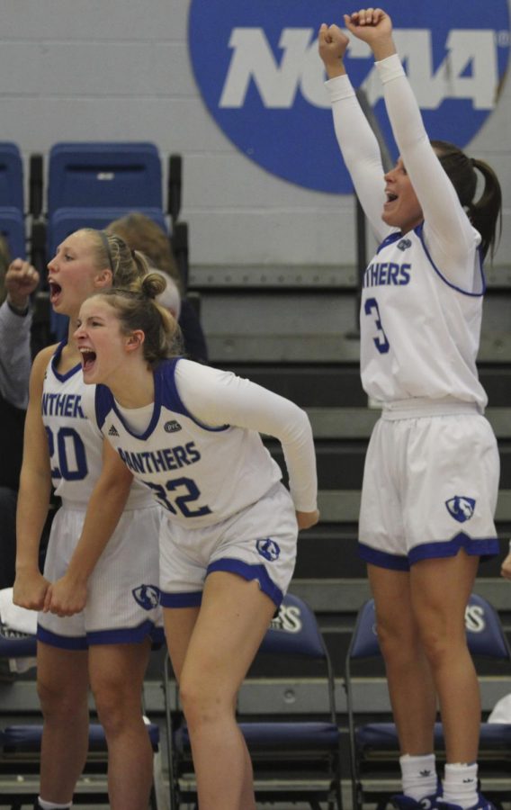 Eastern players (from left) Julia Bengston, Parker Stafford and Miah Monahan celebrate from the bench during the Panthers 85-74 win against Evansville on Nov. 20 in Lantz Arena. 