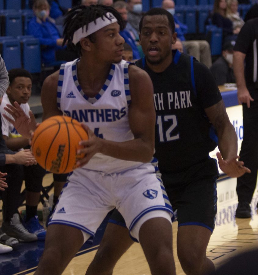 Eastern guard CJ Lane looks to pass in Easterns game against North Park on Dec. 4 in Lantz Arena. The Panthers won the game 76-71. 