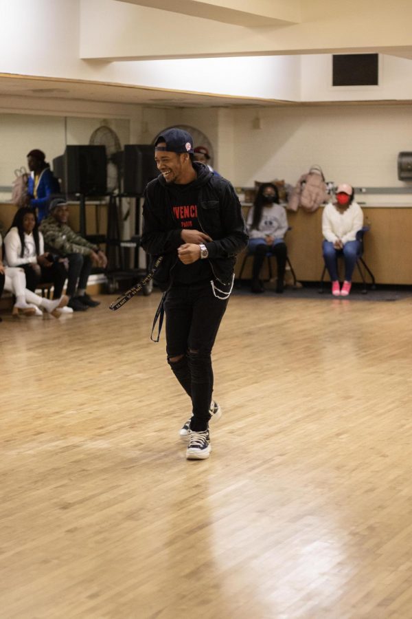 In McAfee Gym Thursday night, Armani Brooksstreet, a sophomore criminal justice major, dances and has fun while taking his turn during the modeling audition event.