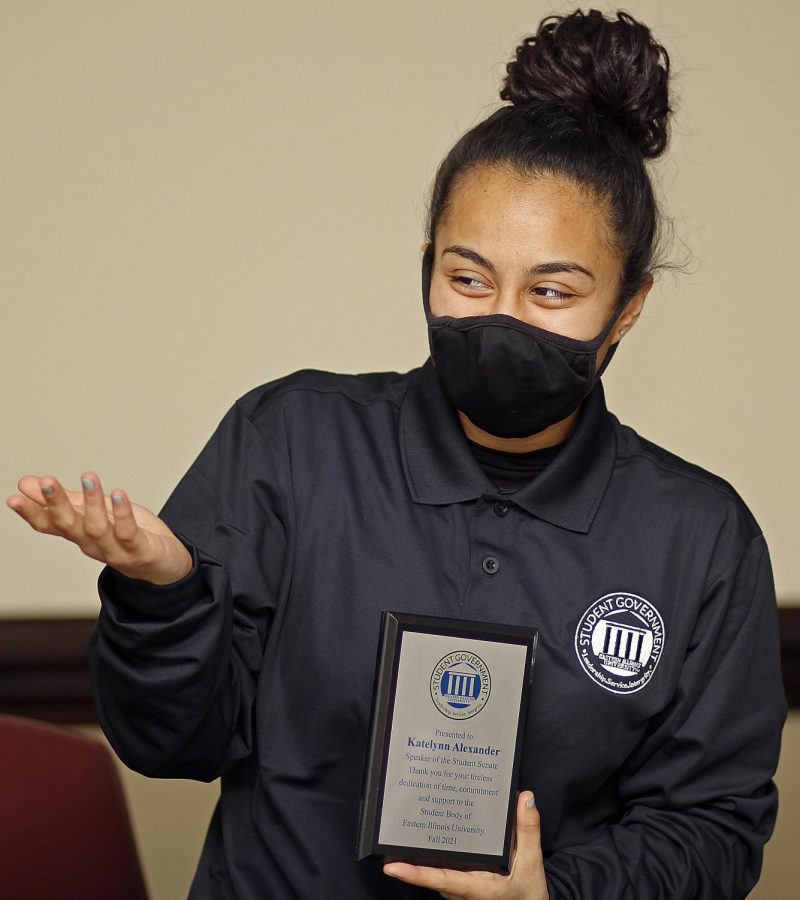 Student Senator Jasmine Yusef, a junior English major, awarded Speaker Katelynn Alexander, a senior political science major a plaque thanking her for her dedication to the Student Senate over the past semester Wednesday night. The plaque reads “Presented to: Katelynn Alexander Speaker or the Student Senate. Thank you for your tireless dedicatio of time, commitment and support to the Student Body of Eastern Illinois University Fall 2021.”