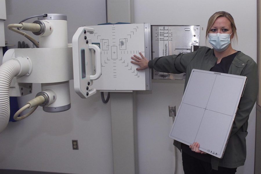 Sara Verdeyen, Eastern’s radiographer, showcases the new x-ray machine that was purchased. Verdeyen said that on average, depending on the season, she sees around 10 people a week to do x-rays. 