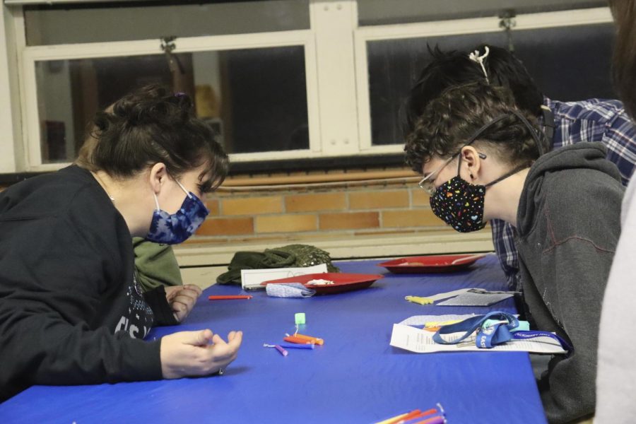 People who joined the Latkes and Lights event in honor of Hanukkah, learn about the history of the holiday while playing a game of Dreidel in McAfee Wednesday night.