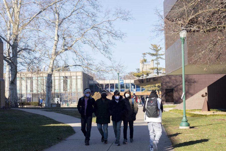 Students walk to their classes on the first day of the Spring semester on Monday afternoon.