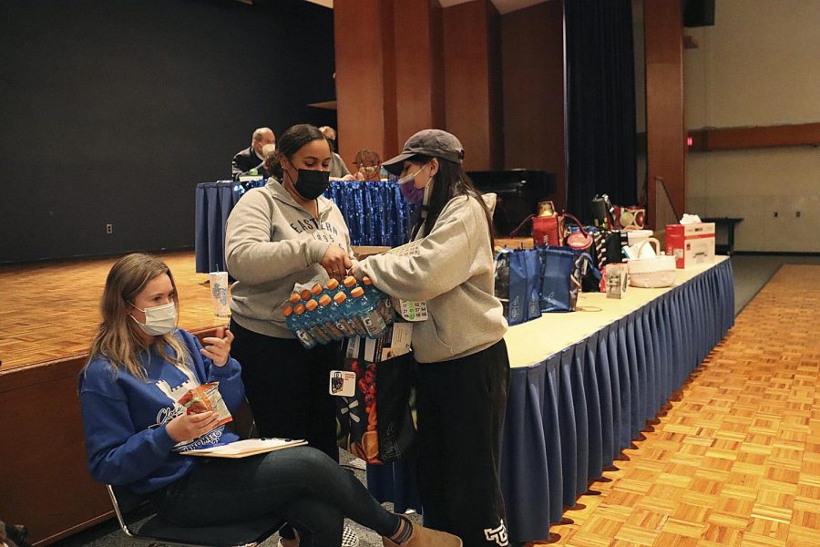 Kaitlin Santiago, a junior English major, wins her bingo prize after competing against other students in the Grand Ballroom during one of the Winter Welcome Dayz events.