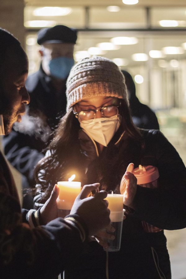 Imani Walker, a senior neuroscience major, lights her candle for the 35th annual Martin Luther King Jr. vigil outside of Thomas Hall presented by Alpha Phi Alpha Fraternity Incorporated. 