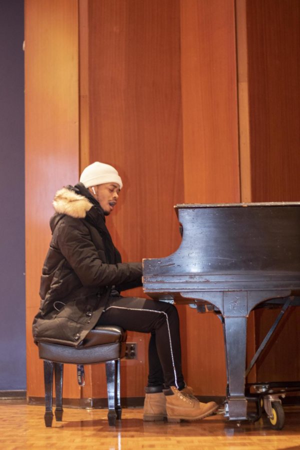 Armani Brooksstreet, a sophomore criminal justice major, performs a song while playing the piano during the Martin Luther King Jr. celebration inside the Grand Ballroom in the Martin Luther King Jr. Union. 