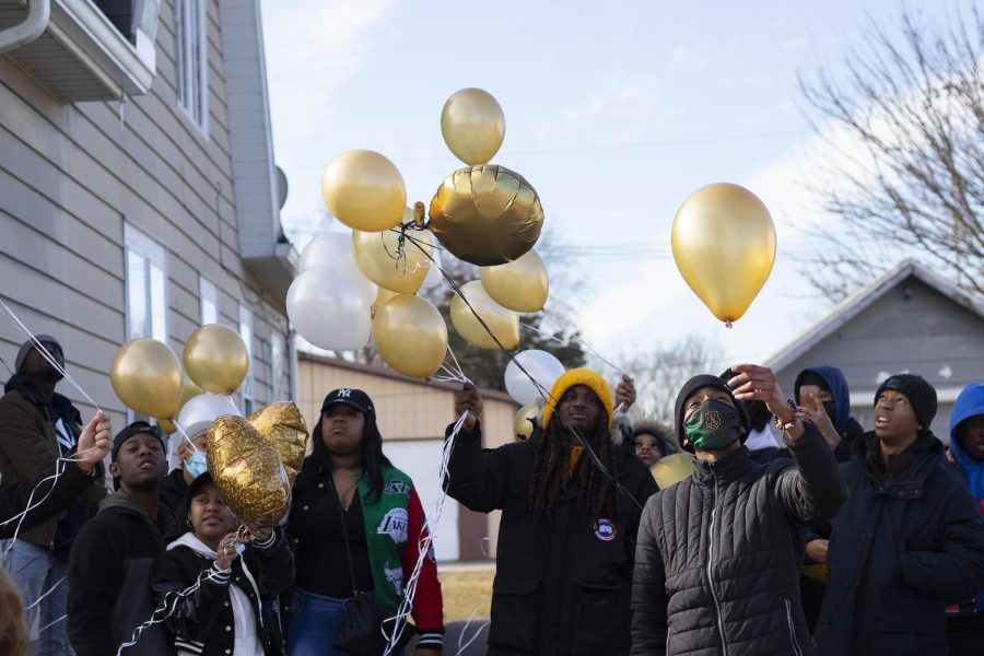 People release balloons in honor of former Eastern student Kristian Philpotts Saturday afternoon.