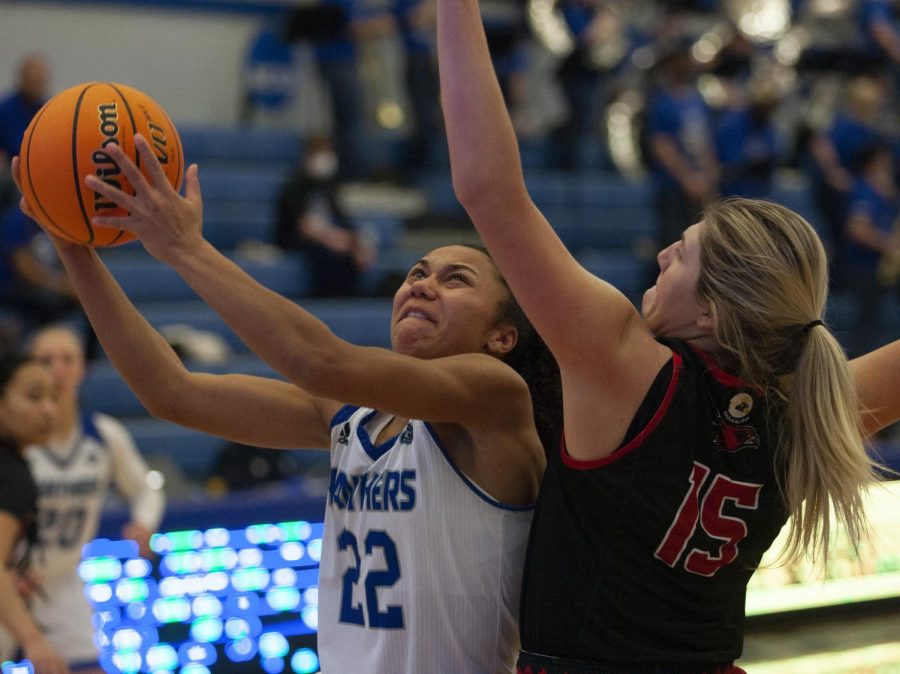 Eastern guard Lariah Washington fights through contact to make a layup in the Panthers game against Southeast Missouri Saturday in Lantz Arena. Washington scored 21 points in the game, which Eastern won 68-44. 