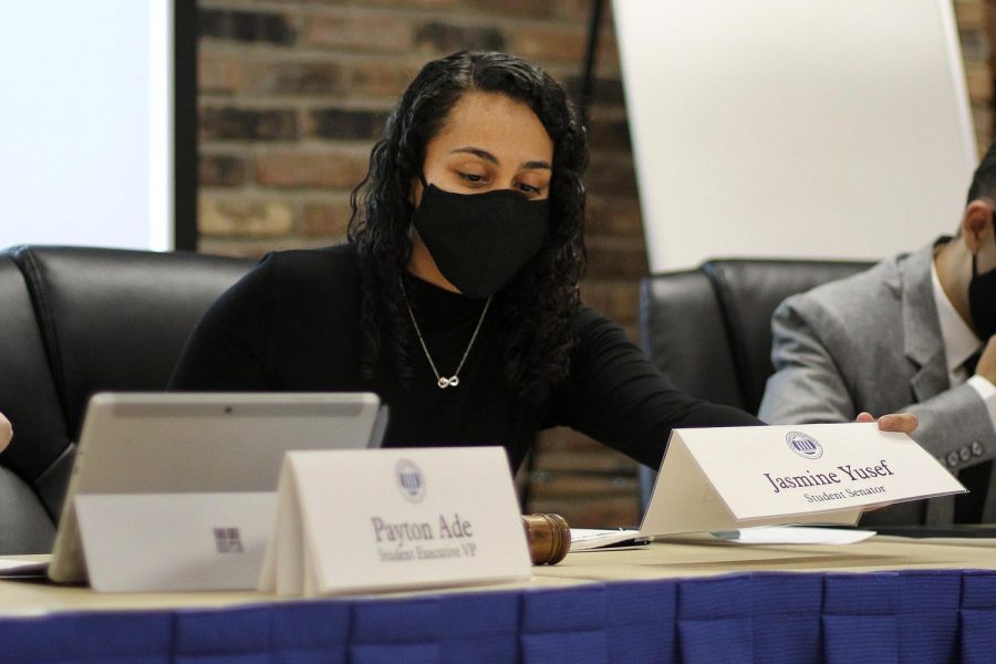 Student Senate Speaker Jasmine Yusef, a junior English major, places her name plate in the spot of the Speaker after being elected Speaker at Wednesdays Student Government meeting.