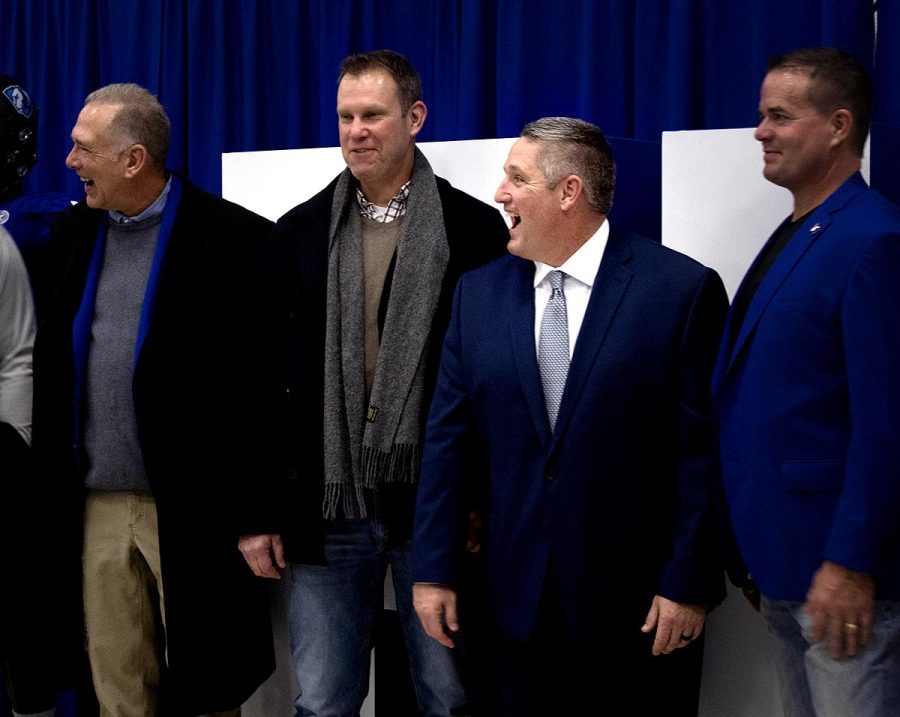 Easterns new football Head Coach, Chris Wilkerson, socializes with former teammates and alumn from the football program at Wilkerson’s press conference on Friday in the Hall of Champions in Lantz Arena.