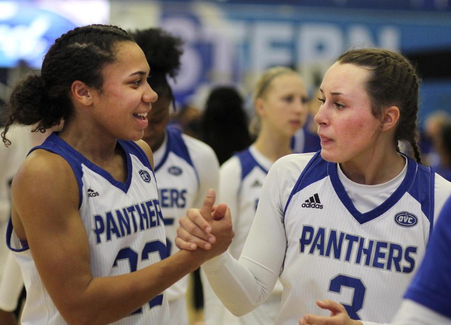 Eastern guards Lariah Washington (left) and Miah Monahan celebrate the Panthers overtime win over Tennessee State Saturday in Lantz Arena. Washington scored a team-high 20 points and surpassed the 1,000-point mark for her career. 