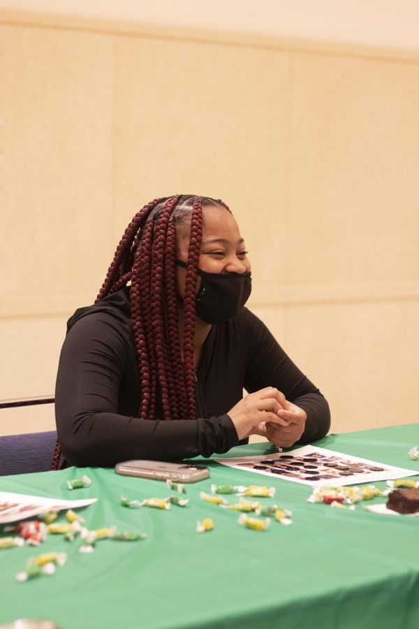 Qwen Collins, a junior nursing major, tries to win different prizes by playing Black History Bingo Monday night for the African American Heritage Month Kickoff event.
