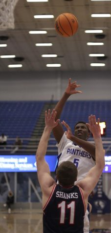 Eastern forward Paul Bizimana puts up a shot in the Panthers’ game against Belmont on Monday in Lantz Arena. Bizimana scored 20 points in the game, which Eastern lost 90-56. 
