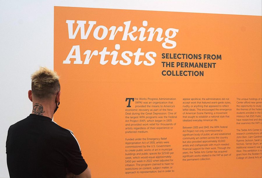 Tarble Arts Center Assistant Director and Exhibitions Curator Mike Schuetz, makes sure everything is prepared for the opening of  the Working Artists Exhibit on Monday.