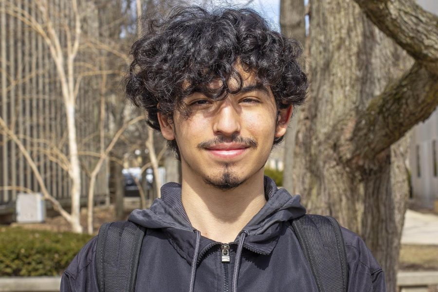 Gordon Baltazar, a freshman biology major, poses for a headshot in the South Quad on Monday.