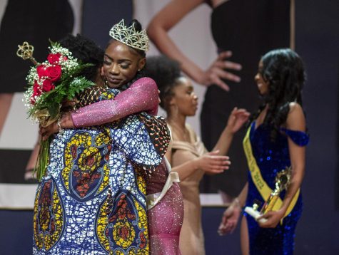 Jaedah Franks, a sophomore biological sciences major, is congratulated by Yolanda Williams after being crowned Miss Black EIU 2022 on Saturday in the Grand Ballroom.