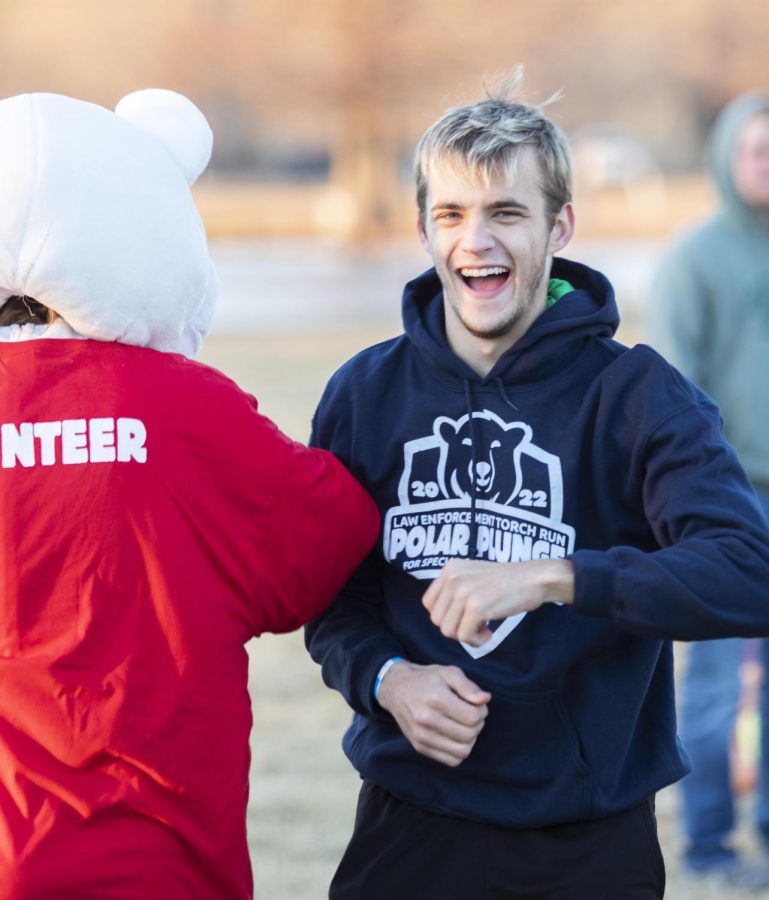 The Polar Plunge bear and his friend have fun and laugh together while waiting for the event to start. The Eastern Illinois University students and faculty along with Charleston, Ill. community members compete in the 2022 Law Enforcement Torch Run Polar Plunge for the Special Olympics Illinois on Sunday.