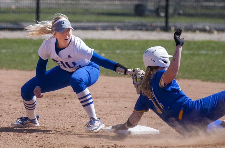 Eastern shortstop Megan Burton attempts to place a tag on a Morehead State baserunner in first game of a doubleheader on Sunday at Williams Field. Eastern won the game 4-0. 