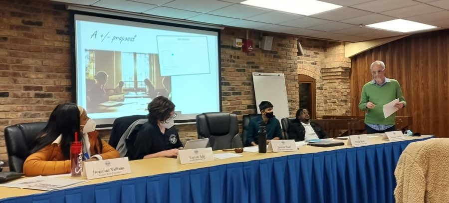 The Student Government executive board and speaker of the senate listen to Don Holly, a professor of anthropology, explain his idea to change Easterns grading point system to a +/- grading point system at Wednesdays meeting.