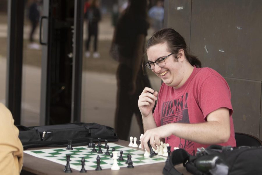 On the pop-up mental health day in the Library Quad, Julian Barbieri, a senior interpersonal communications major plays chess outside while enjoying the warm weather. The chess club meets on Fridays from 5-7 p.m. at the Martin Luther King Jr. University Union bridge. 