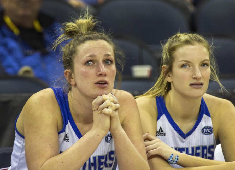The EIU women's basketball team members, from left, senior Abby Wahl and sophomore Parker Stafford sit on the bench in the last 30 seconds of the Panthers 72-61 loss to Tennessee State in the OVC Tournament in Ford Center in Evansville, Indiana, on Wednesday.