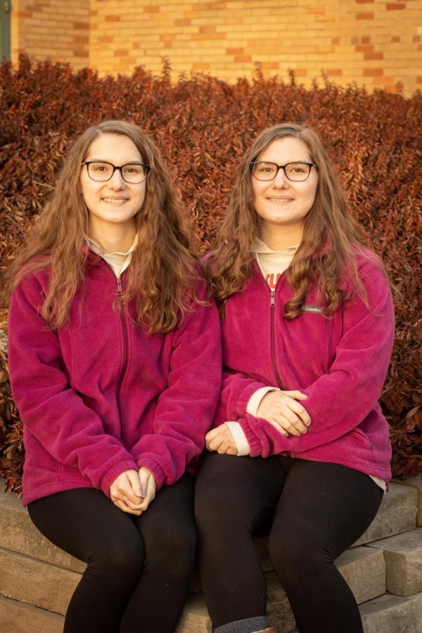 Ashley Mlinar and her twin sister, Haley Mlinar pose for pictures outside of Buzzard Hall on Mar. 3, 2022, at Eastern Illinois University in Charleston, Ill.