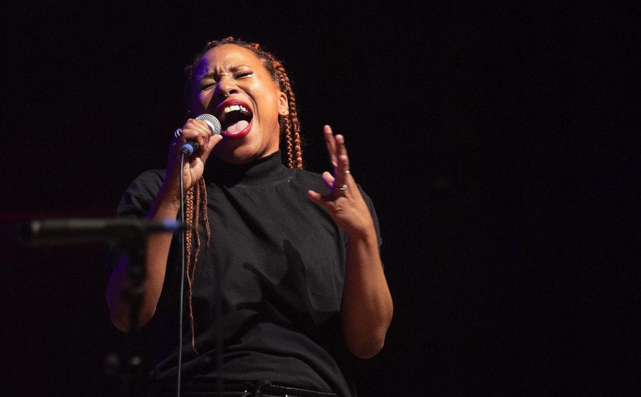 Aja Black, vocalist and emcee for The Reminders belts in the third song called “Dust and Bones” in the Dvorak Concert Hall Thursday. The Reminders performed on March 10, during the 2022 Premier Season for Doudna. 