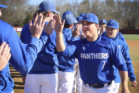 Eastern utility player Ryan Ignoffo (7) high fives his teammates after the Panthers’ 3-2 win over McNeese State on March 18. The Panthers won the series to improve to 13-4 on the season.