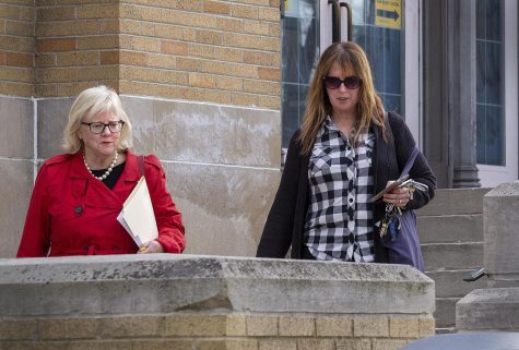 Laura McLaughlin, Eastern’s general counsel, and Amie Calvert the director of office employee and labor relations leave Booth Library after hearing the University Professionals of Illinois team’s demand to bargain in regards to wages Monday afternoon.