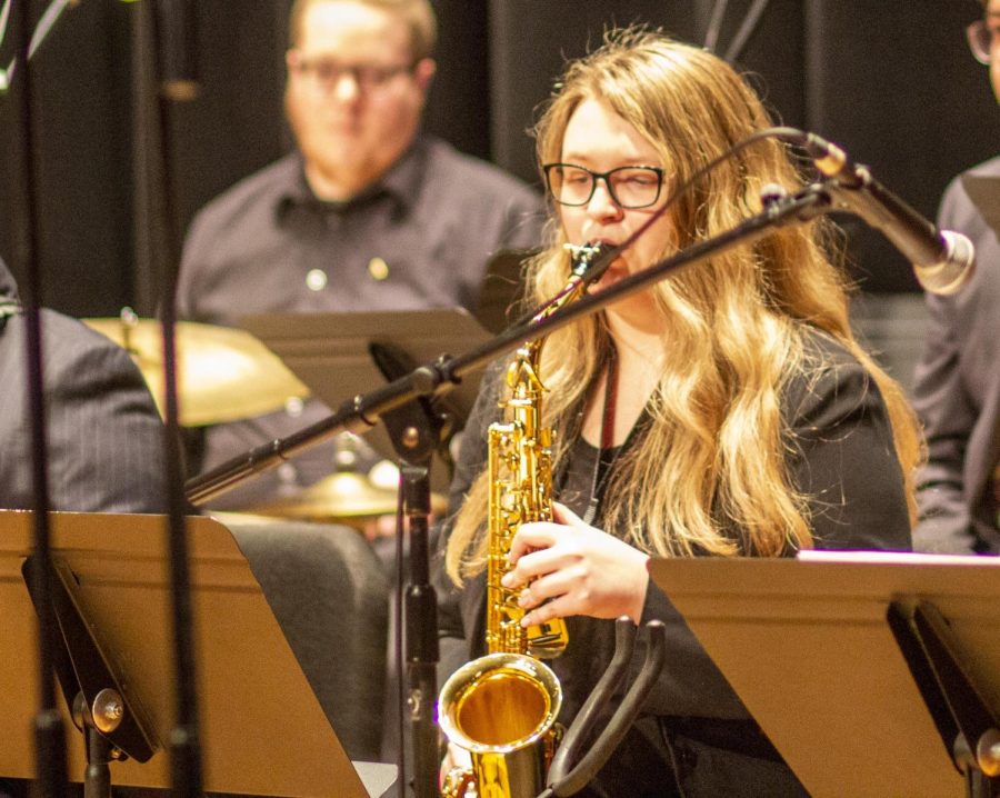 Kirsten Hetzel, a sophomore music education major, plays the alto saxophone at the jazz concert alongside Chuck Israels in the Dvorak Concert Hall Tuesday night. 