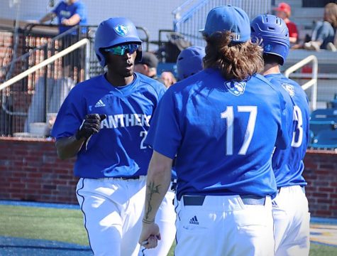 Eastern shortstop JaLil Akbar high fives teammates after scoring a run in Easterns road game against McNeese State on March 19. Akbar was 1-for-4 with the run in the game, which Eastern lost 6-3.