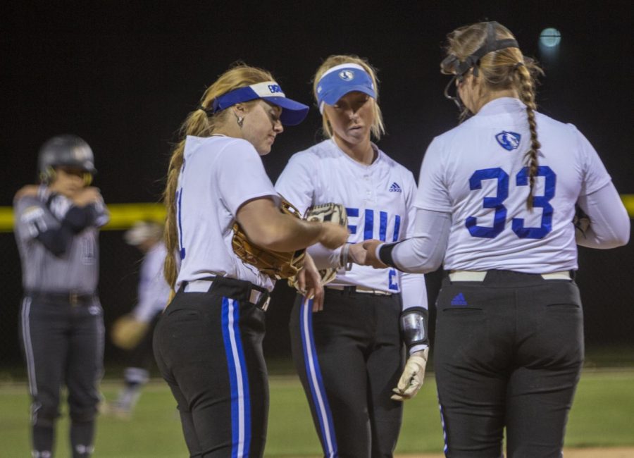 From left, Maddie Swart (33), a sophomore political science major, Megan Burton (2), a senior educational leadership major, and Rachel Kaufman (33) a sophomore marketing major, talk in between plays during the second game against the Purdue Fort Wayne Mastodons. The Panthers won both games, the first 13-8 and the second 3-2 on Wednesday night.