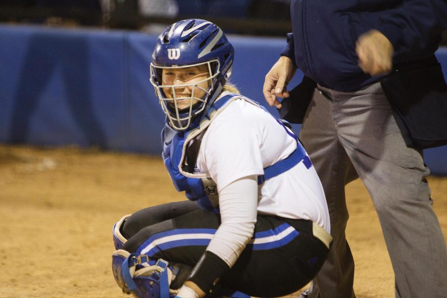 Eastern+catcher+Lindy+Milkowski+looks+to+the+dugout+and+smiles+during+game+two+of+a+doubleheader+against+Purdue+Fort+Wayne+April+6+at+Williams+Field.+The+Panthers+won+both+of+the+games%2C+13-8+and+3-2.+