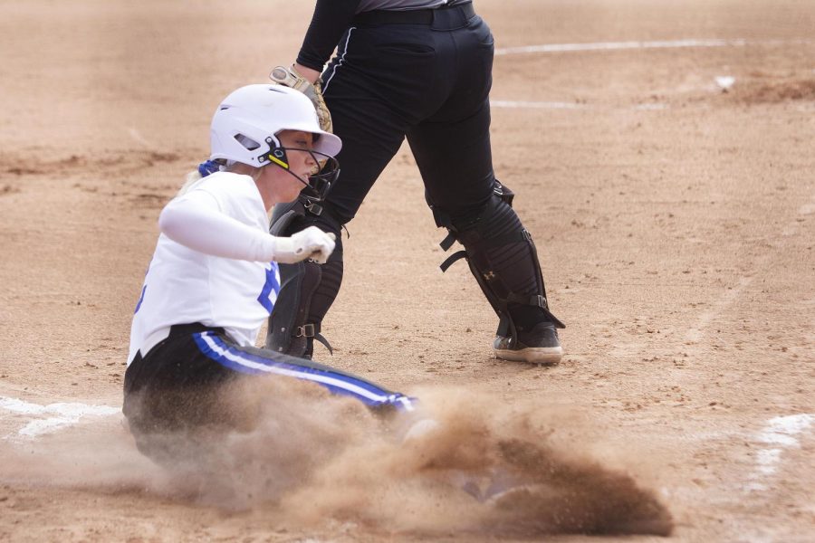 Eastern shortstop Megan Burton slides into home in the second game of a doubleheader against Purdue Fort Wayne on April 6 at Williams Field. Burton walked and scored a run in the game, which Eastern won 3-2. 