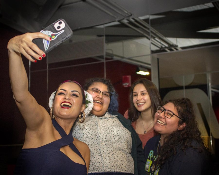 From left, Denise Carlos, MSW, vocalist for Las Cafeteras, Veronica Palacios, a senior Spanish Hispanics studies major, Kassandra Garcia, a senior human services major, and Diana Argueta, a senior Spanish graphic design major, take a selfie during the post-show meet up at The Doudna Fine Arts Center Thursday night. Palacios said that she wants the Latinx community to be represented, and when able, show support. They definitely took my support and while there are Latinx people in Charleston, it is hard to feel like a community, Palacios said. When theres an opportunity to do so its always great to show up and support.