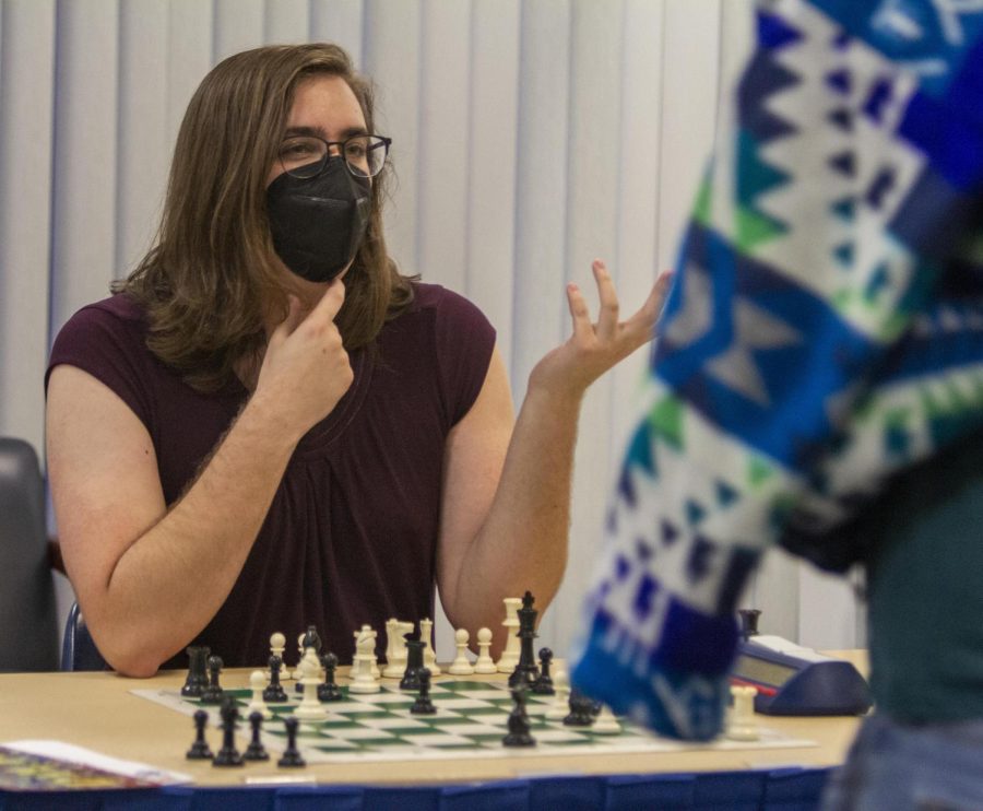 President of the chess RSO on the Eastern Illinois University campus, Jules Barbieri, a senior interpersonal communications major, plays chess at Pantherbash Thursday night. 