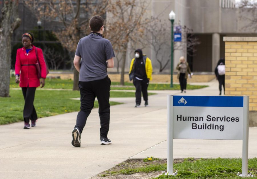 Students walk outside the Human Services Building Monday afternoon. 