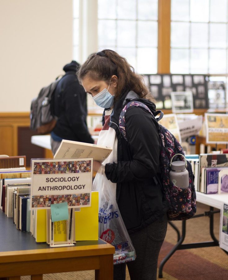 Kaitlyn Kiesler, a freshman communication disorder and sciences major, attends the Spring Book Sale Wednesday afternoon and gathers a few books to take with her. She says, “I thought it was very cool how there were so many different types of books for such a cheap price.”