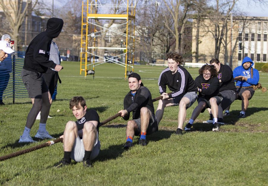 Members of Sigma Pi Fraternity Inc., struggle to win at the Tugs event for Greek Week but make a great turn around in the end, where they end up winning against the other team on Monday evening at the Campus Pond on April 18, 2022 at Eastern Ilinois University in Charleston, Ill.