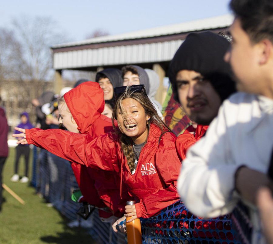 Hanna Zayas, a junior exercise science major, cheers on the Sigma Pi Fraternity Inc., after they win at the Tugs event for Greek Week on Monday evening at the Campus Pond on April 18, 2022 at Eastern Ilinois University in Charleston, Ill.