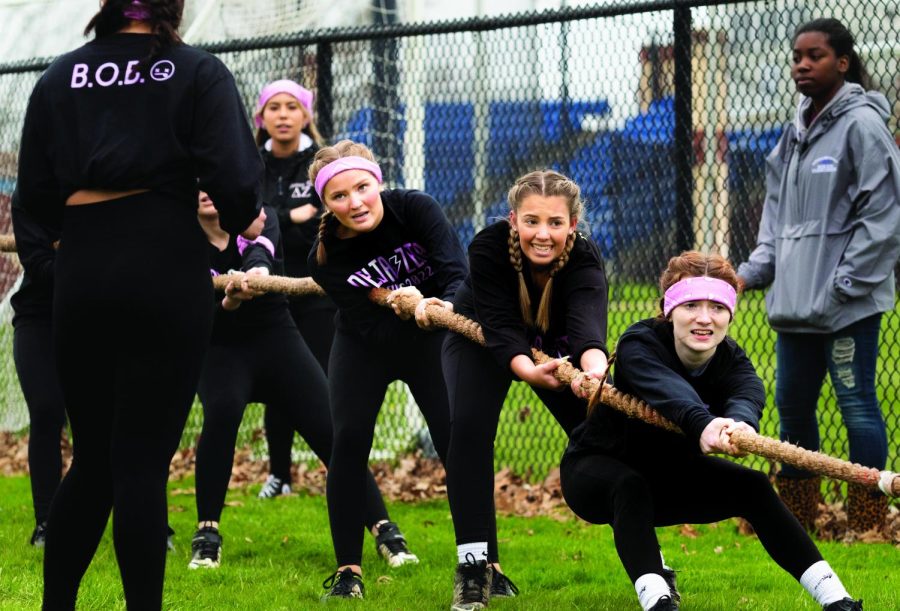 Members of Delta Zeta compete against the opposing team during Tugs for Greek Week at the Campus Pond Wednesday afternoon.