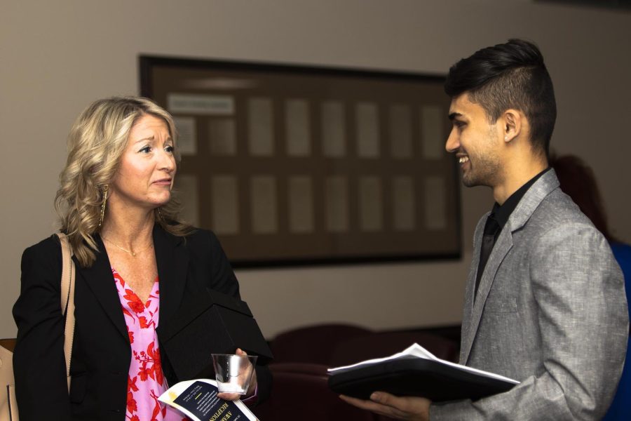 Dr. Angela Yoder thanks Prabin Karki, a junior mathematics major, and Student Vice President of Academic Affairs, for the Distinguished Professor Award on Thursday afternoon.