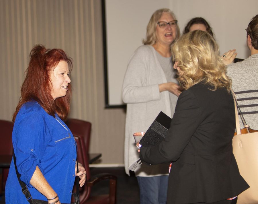 Dr. Kathleen O’Rourke, and Dr. Angela Yoder, have a conversation after receiving their Distinguished Professor Award from the members of Student Government.