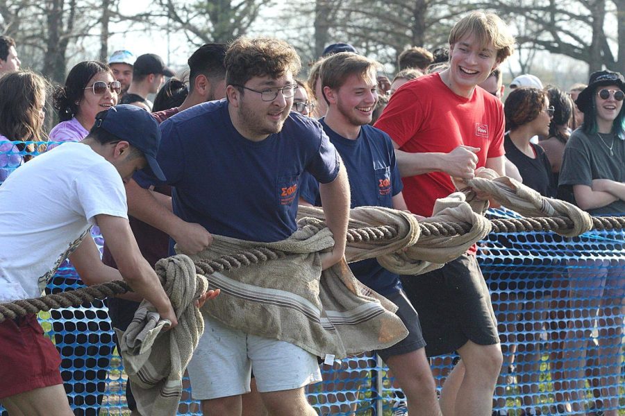 Members of a fraternity dry the rope for Sigma Pi Epsilon before their round of tugs begin Friday afternoon at the Campus Pond.