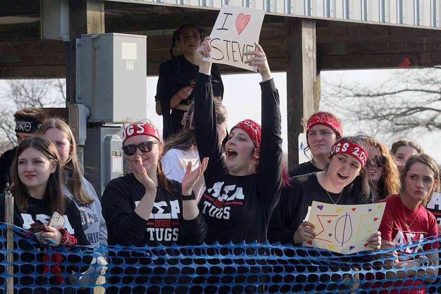 Members of Alpha Sigma Alpha cheer on the members of Sigma Pi Epsilon during their round of tugs Friday afternoon at the Campus Pond.