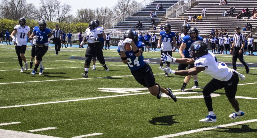 ollin Tyson (24), a freshman sport management major, intercepts the ball on a throw during the Alumni Social Spring Game Saturday afternoon at OBrien Field.