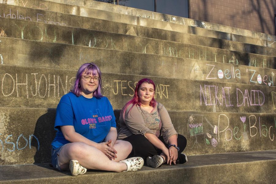 From left, Hannah Wallace, a junior computer and information technology major, and Sabrina Bunting, a sophomore English education major, pose for a picture at the Mellin Steps Friday evening. The two said having Douglas Hall named after Stephen Douglas was not a good representation of Eastern and that Eastern is trying to better itself. 