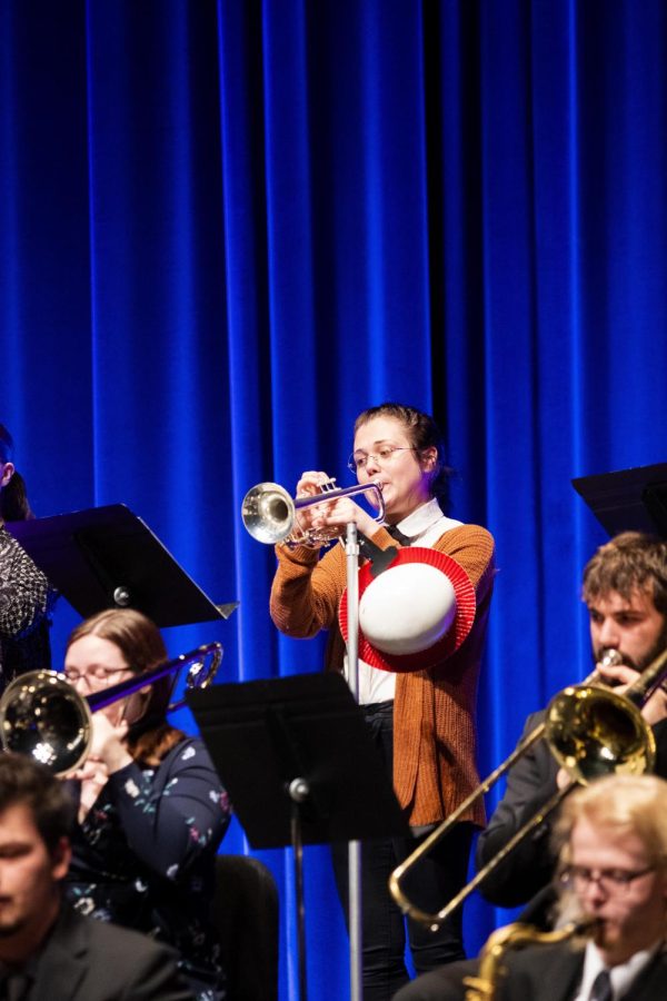 Anissa Massey, a music teacher education major and trumpet player, reads music notes while she performs a song with the rest of the Jazz Ensemble Personnel in Doudna Fine Arts Center Tuesday night.