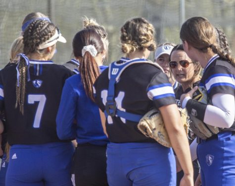 Eastern softball coach Tara Archibald talks to the team during the eighth inning during the first game of a doubleheader against SIUE Wednesday afternoon. The Panthers won the game 6-5 in 11 innings. 
