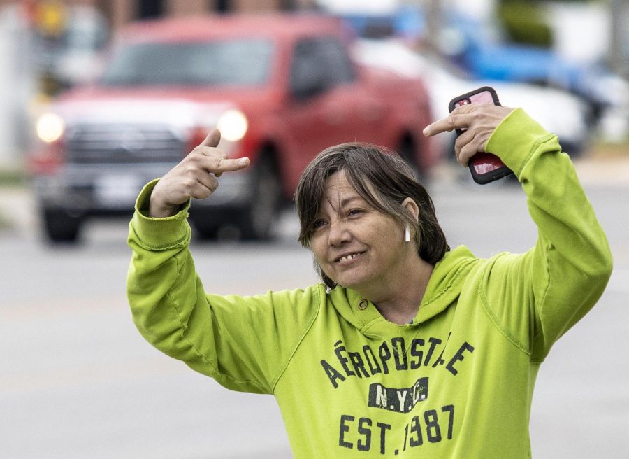 Bridget Price flips off pro-choice protesters at Morton Park on Lincoln Ave. Friay at noon.